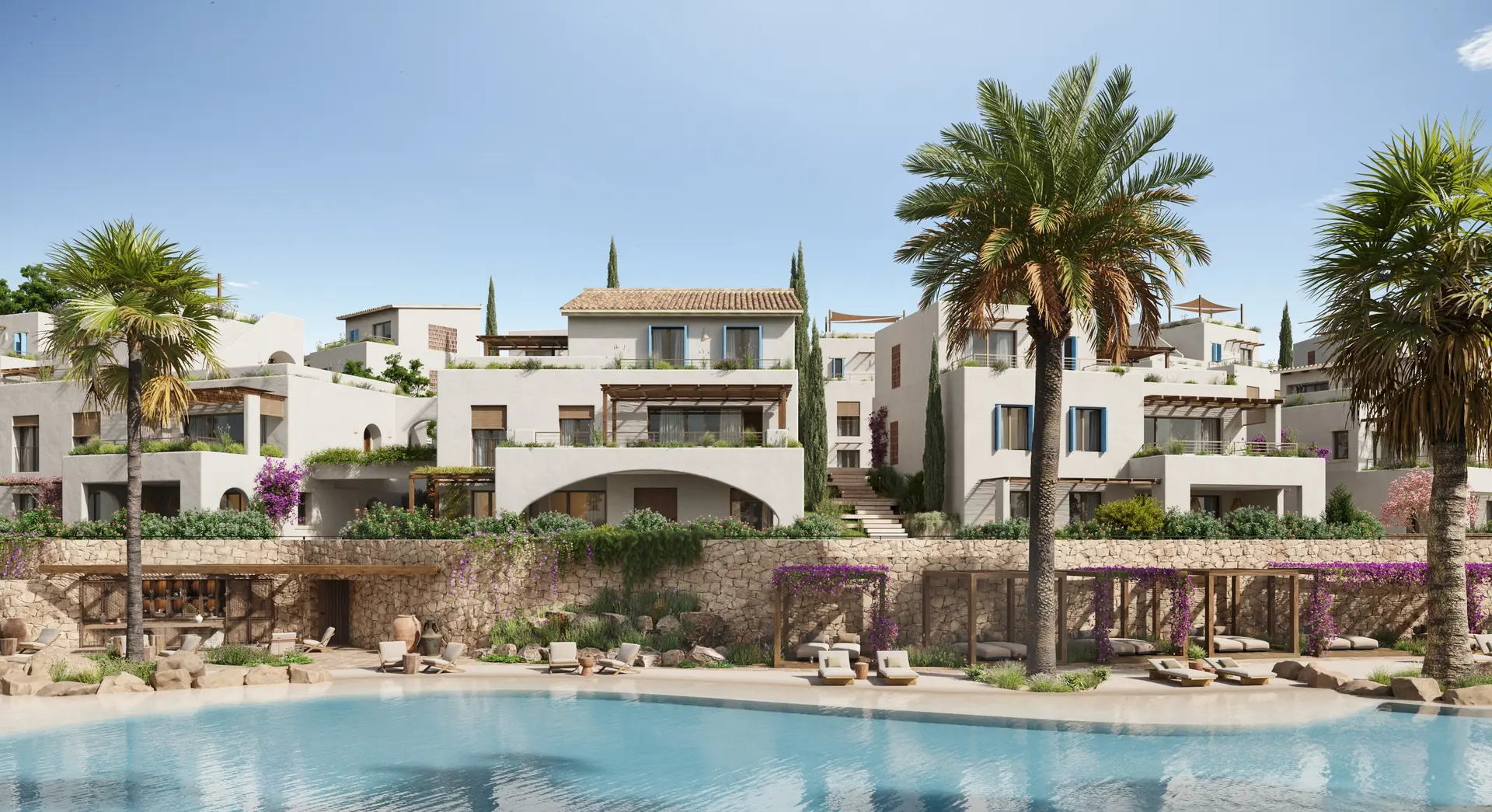 El poblado de Azure visto desde la piscina de arena, con las villas blancas escalonadas entre palmeras